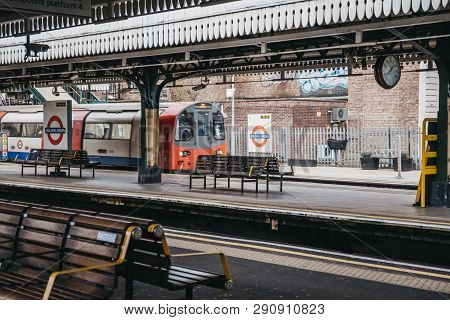 London, Uk - March 16, 2019: London Underground Train Arriving At An Outdoor Platform Of Golders Gre