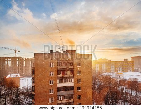 Winter Sunset With Snowfall. Cloudscape With Sun Rays Upon Odintsovo Town, Russia.