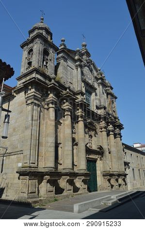 Main Facade Of The San Bartolome Parish On Sarmiento Street In Pontevedra. Nature, Architecture, His