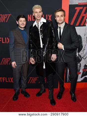 LOS ANGELES - MAR 18:  Iwan Rheon, Machine Gun Kelly and Douglas Booth arrives for the Netflix 'The Dirt' Premiere on March 18, 2019 in Hollywood, CA                