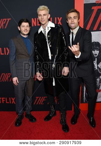 LOS ANGELES - MAR 18:  Iwan Rheon, Machine Gun Kelly and Douglas Booth arrives for the Netflix 'The Dirt' Premiere on March 18, 2019 in Hollywood, CA                