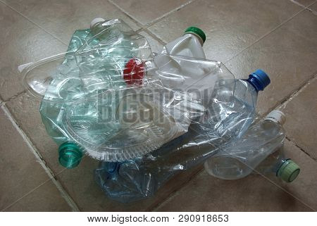 View Of A Bunch Of Empty Multicolored Plastic Bottles Prepared For Recycling. Crumpled Clean Plastic