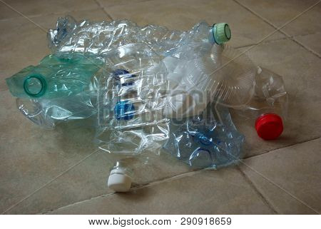 View Of A Bunch Of Empty Multicolored Plastic Bottles Prepared For Recycling. Crumpled Clean Plastic