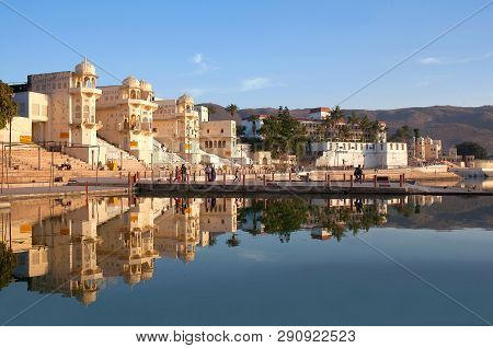 Pushkar, India - January 5, 2019: Pilgrims Walking On Varaha Ghat Along Pushkar Sarovar Lake. It Is 