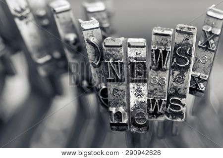 the word NEWS with old typwriter hammers macro image  monochrome image 