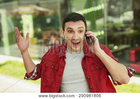 Wondering Handsome Man Hearing Happy Numbing News