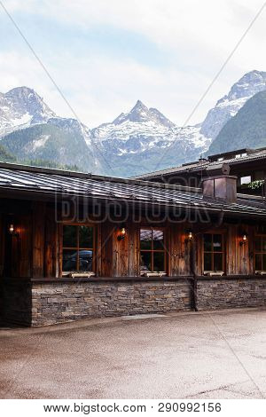 An Old, Vintage, Wooden House Is Located In The Alps