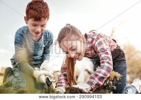 Smiling Children Laughing When Seeing Worm In Land