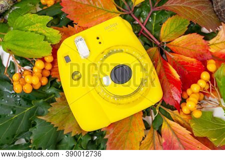 August 29, 2020, Rostov, Russia: Instant Camera Fujifilm Instax Mini 9 Lies On Colorful Autumn Leave