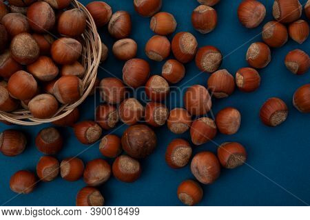 Many Nuts Lie On The Table And Basket Top View