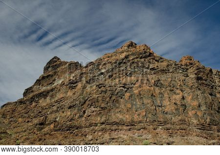 Rocky Cliff And Clouds In The Special Natural Reserve Of Guigui.