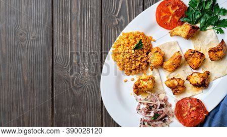 Light And Delicious Grilled Chicken Kebab, Located On A Platter With Tomato And Bulgur, Decorated Wi