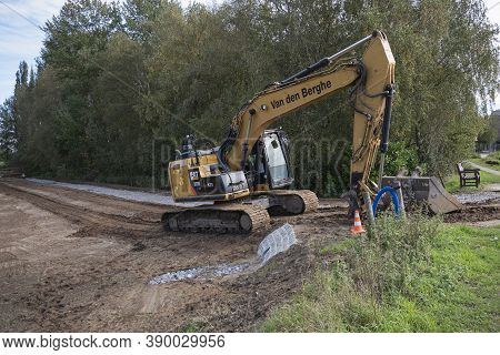 Sint Gillis Waas, Belgium, October 15, 2020, Large Excavator Digs A Road In A Former Park