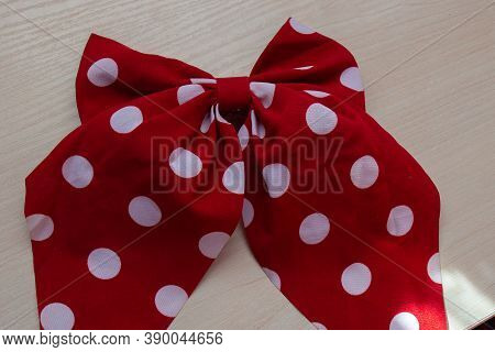 Beautiful Fragile Red Bow Lying On The Table
Red Hair Bow 
Red And White Hairpin