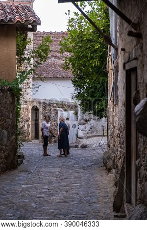 Kakopetria, Cyprus - July 22, 2020: People Strolling In The Picturesque Narrow Streets Of Old Kakope