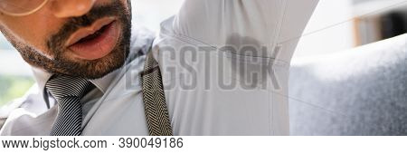 Armpit Sweat Stain From Deodorant Or Hyperhidrosis. Men Sweating