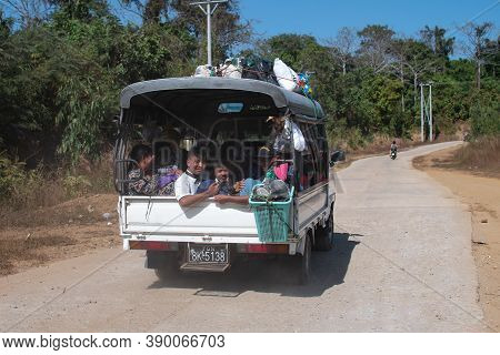 Chaung Thar, Myanmar - December 26, 2019: A Truck Filled With Unidentified People Drives On An Aspha