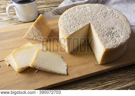 Artisanal Canastra Cheese From Minas Gerais, Brazil With Coffee Cup Over Wooden Table.