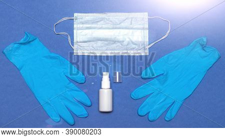 Face Mask With Hand Sanitizer Bottle, And Latex Gloves. Coronavirus Prevention Medical Surgical Mask
