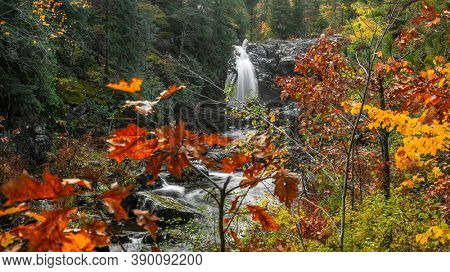 Scenic Dead river water falls in Michigan upper peninsula near Marquette city during autumn time