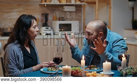 Angry Man For Positive Pragnancy Test During Romantic Dinner. Woman Surprising Her Husband Being Pre