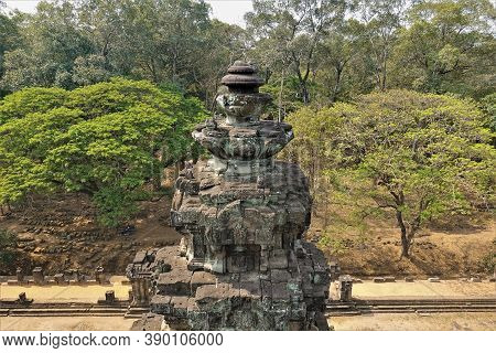 Angkor Architecture. The Top Of The Temple Is Decorated With Carvings, Ornaments, And Bas-reliefs. T