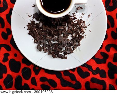 Espresso Cup With Some Chocolate Nibs On Leopard Background