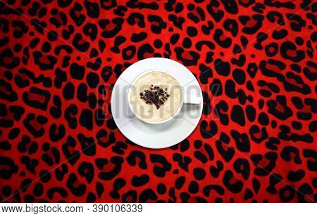 A Cup Of Espresso With Leopard Background
