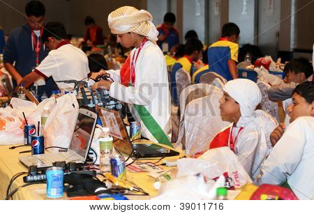 SUBANG JAYA - NOV 10: Unidentified students prepare their robots for the competitions at the World Robot Olympaid on Nov 10, 2012 in Subang Jaya, Malaysia. Students from all over the world too part.