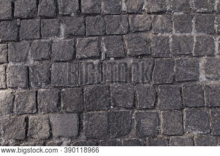 Pavement Texture. Old Paving Stone Mosaic Pattern. Gray Cobblestone Sidewalk Background. Rough Grani