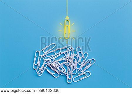 Great Ideas Concept With Paperclip,thinking,creativity,light Bulb On Blue Background,new Ideas Conce
