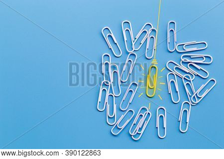 Great Ideas Concept With Paperclip,thinking,creativity,light Bulb On Blue Background,new Ideas Conce