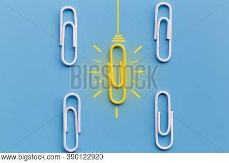 Great Ideas Concept With Paperclip,thinking,creativity,light Bulb On Blue Background,new Ideas Conce