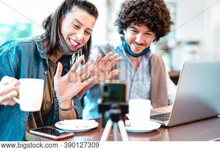 Young Millenial Couple Sharing Creative Content With Facemask - Digital Marketing Concept With Next 