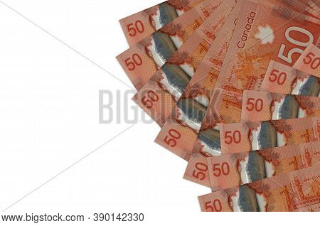 50 Canadian Dollars Bills Lies Isolated On White Background With Copy Space. Rich Life Conceptual Ba