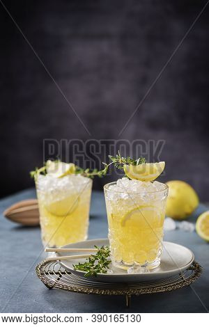 Cocktail With Lemon, Timo And Crushed Ice