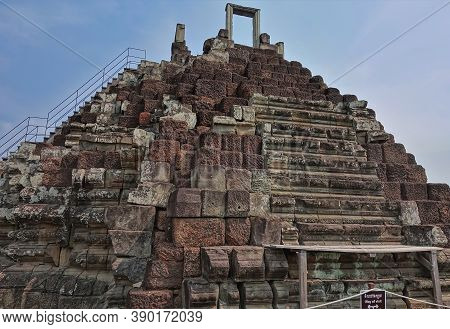 Ruins Of The Famous Angkor. Stone Stairs With Traces Of Destruction From Time And Weather Lead To Th