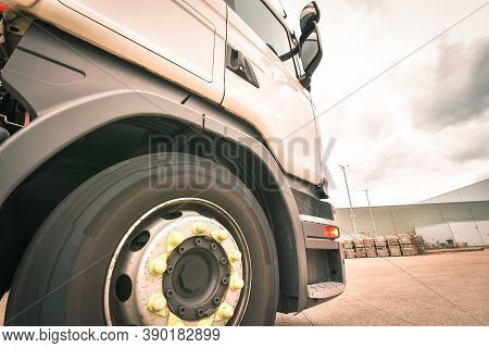Close Up For Cab Of A Lorry With A View Of Big Tyre In Sunny Day