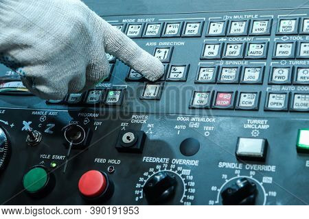 Starting The Machine In Production. The Hand Of The Operator Starts The Cnc Machine To Work