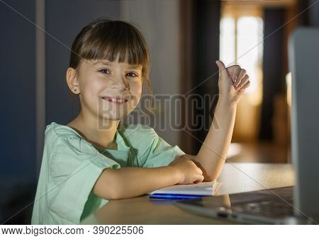 Distance Learning Education. Happy Girl Learn English Language Online With Laptop At Home. Little Gi