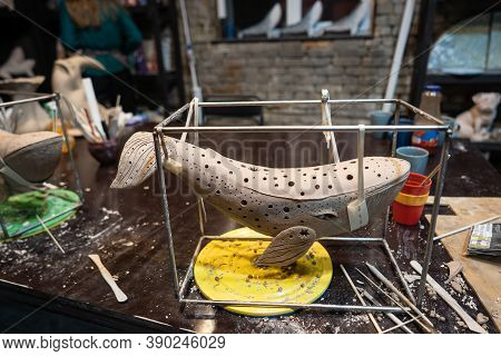 Clay Whale On A Stand In A Pottery Workshop