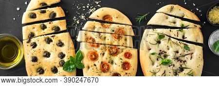 Italian Focaccia Bread With Various Fillings On Black Background. Fresh Baked Focaccia With Tomatoes