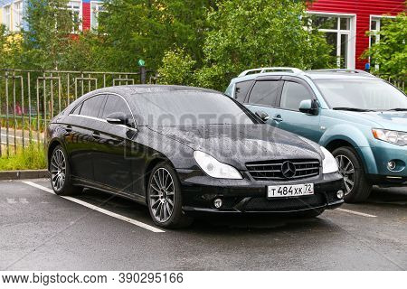 Novyy Urengoy, Russia - July 18, 2020: Black Four-door Coupe Mercedes-benz C219 Cls-class In The Cit