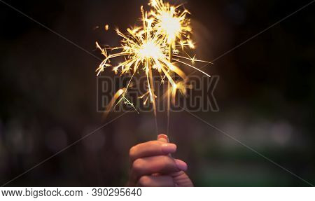 two fireworks are lit together at night for the new year celebration