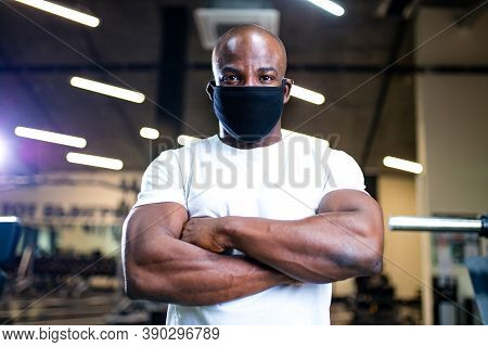 Spain Man In White Cotton T-thirt Wearing Mask While Working Out In Gym