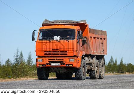 Novyy Urengoy, Russia - June 4, 2020: Orange Dump Truck Kamaz 65222 At The Interurban Road.