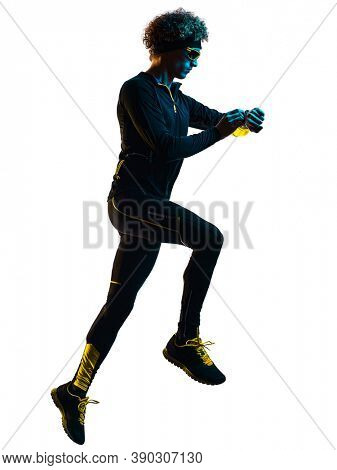 one youg caucasian runner jogger running jogging man using smartwatch chrono in studio shadow silhouette isolated on white background