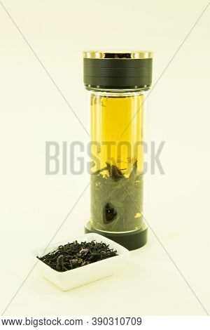 Russian Tea. Blooming Sally. Ivan-tea. Tea Is Brewed In A Double Glass Thermos. Isolated In A White