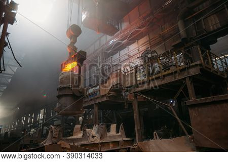 Iron Casting And The Foundry. Overhead Crane With Ladle With Molten Metal At Metallurgical Factory