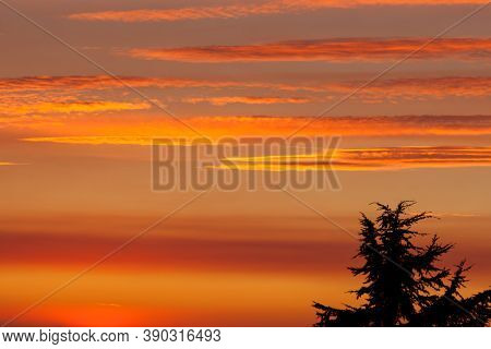 Thick Layers Of Smoke From A Nearby Forest Fire Turn The Suns Rays A Glowing Orange As It Sets Over 